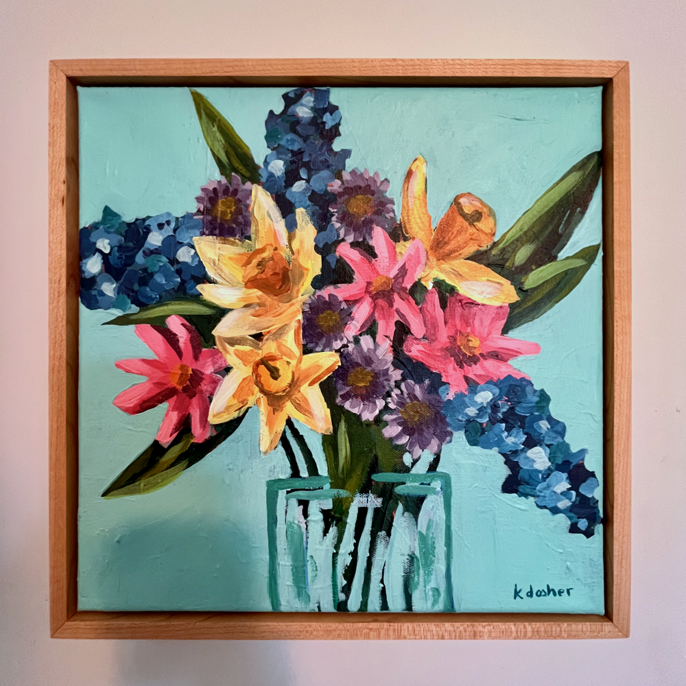 A photograph of an acrylic on canvas painting of a bouquet of flowers in a hand made wooden frame.