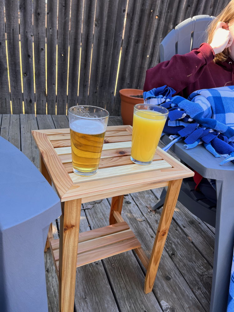 Photo of the table on the deck with two glasses on it