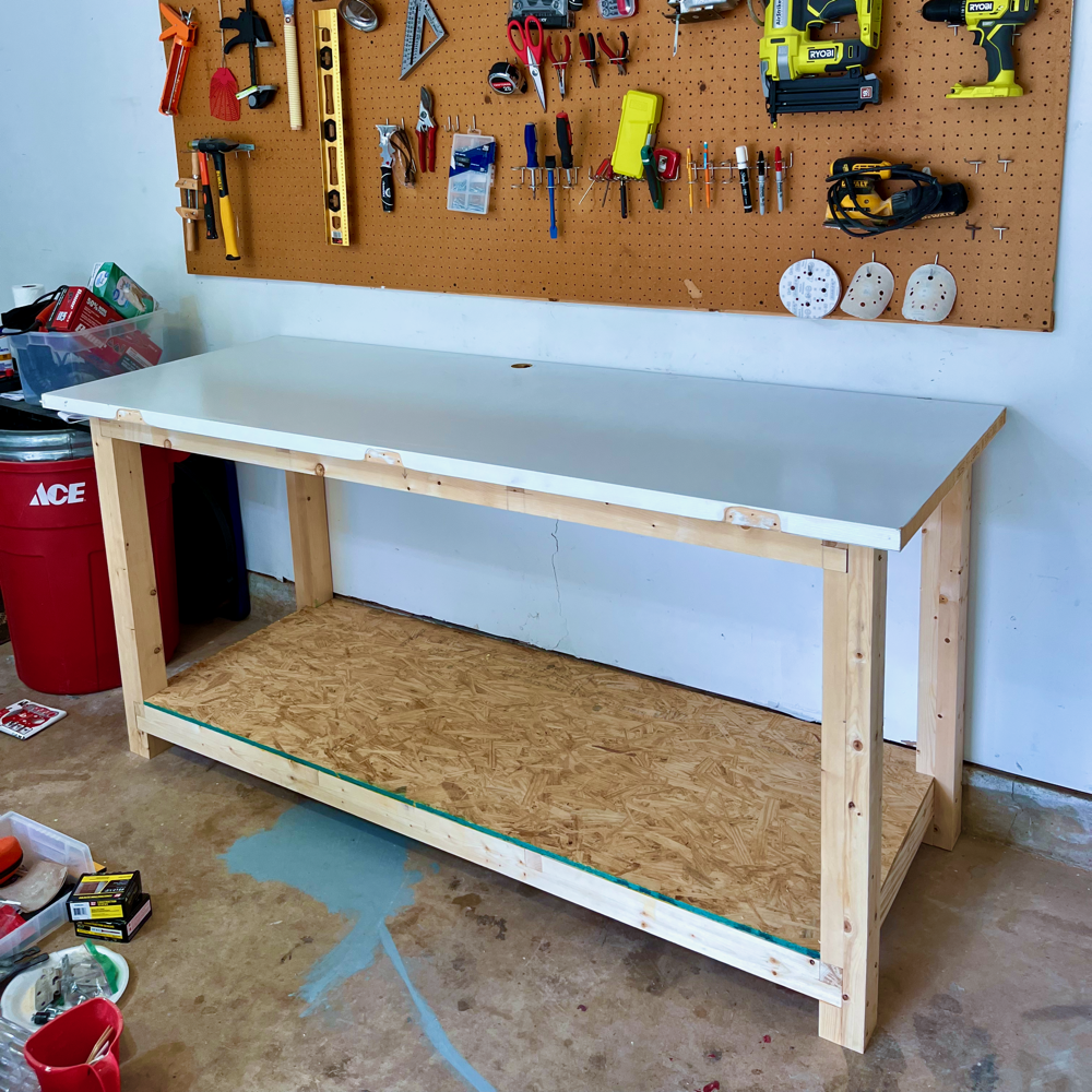 A photograph of the finished workbench (with a white door for a top)